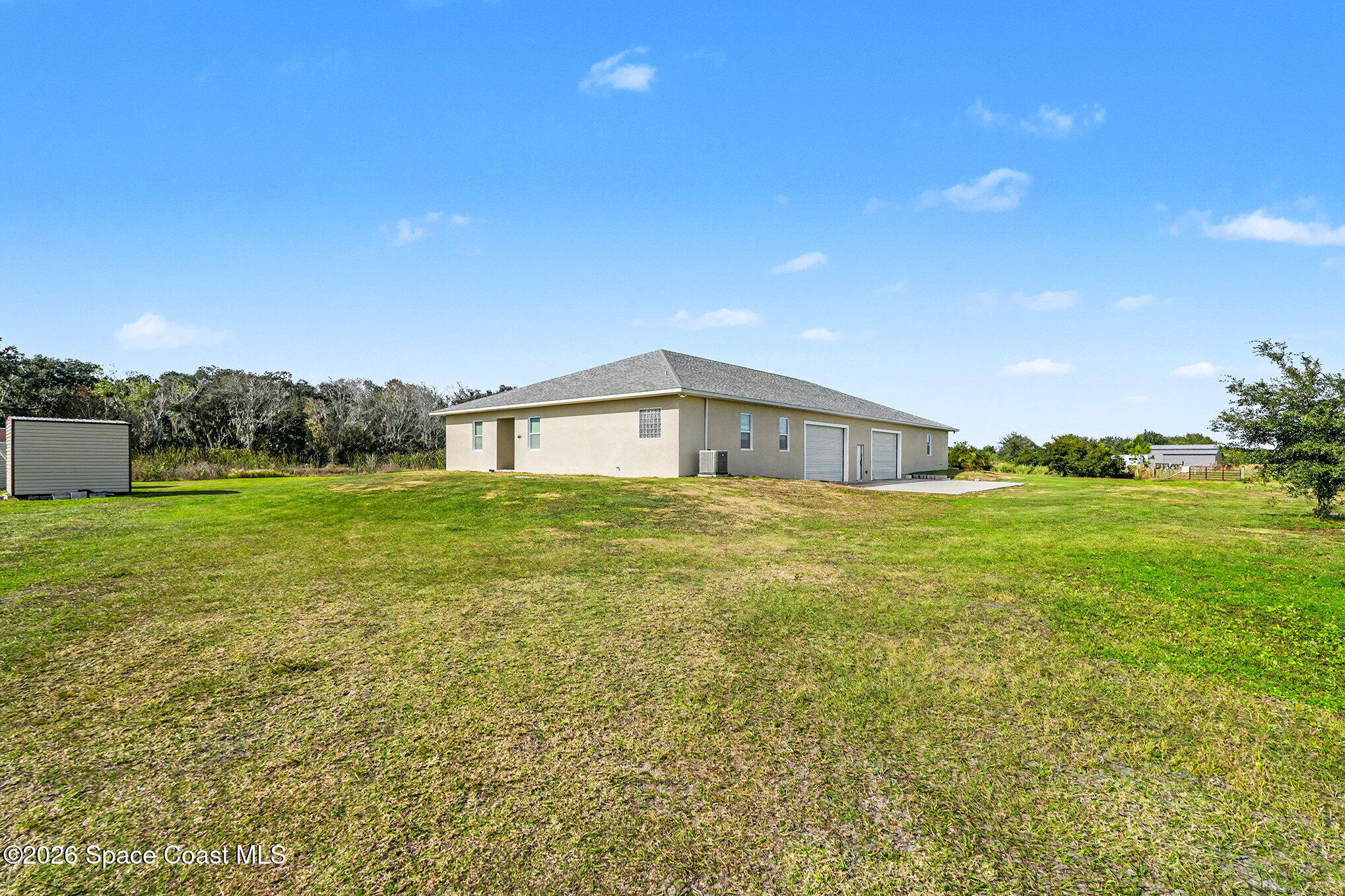 4960 Dixie Way Mims, FL 32754 - Photo 5 of 29 a front view of house with yard and green space