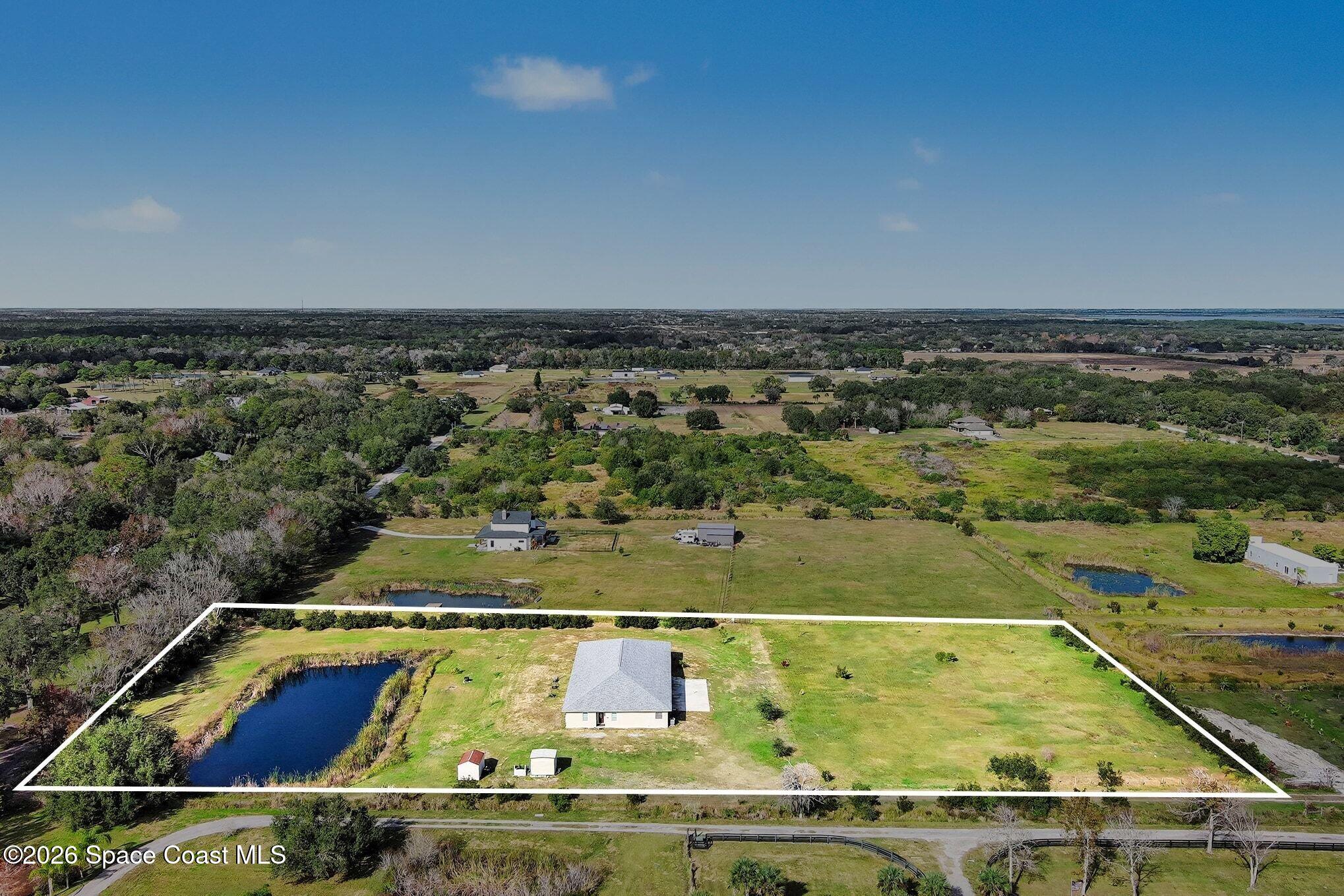 4960 Dixie Way Mims, FL 32754 - Photo 7 of 29 a view of a swimming pool