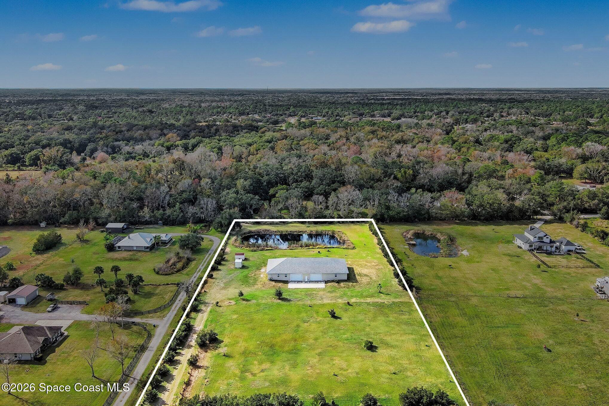 4960 Dixie Way Mims, FL 32754 - Photo 8 of 29 a view of a swimming pool with a yard and lake view