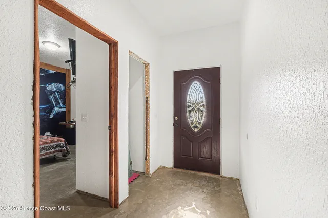 a view of entryway with wooden floor