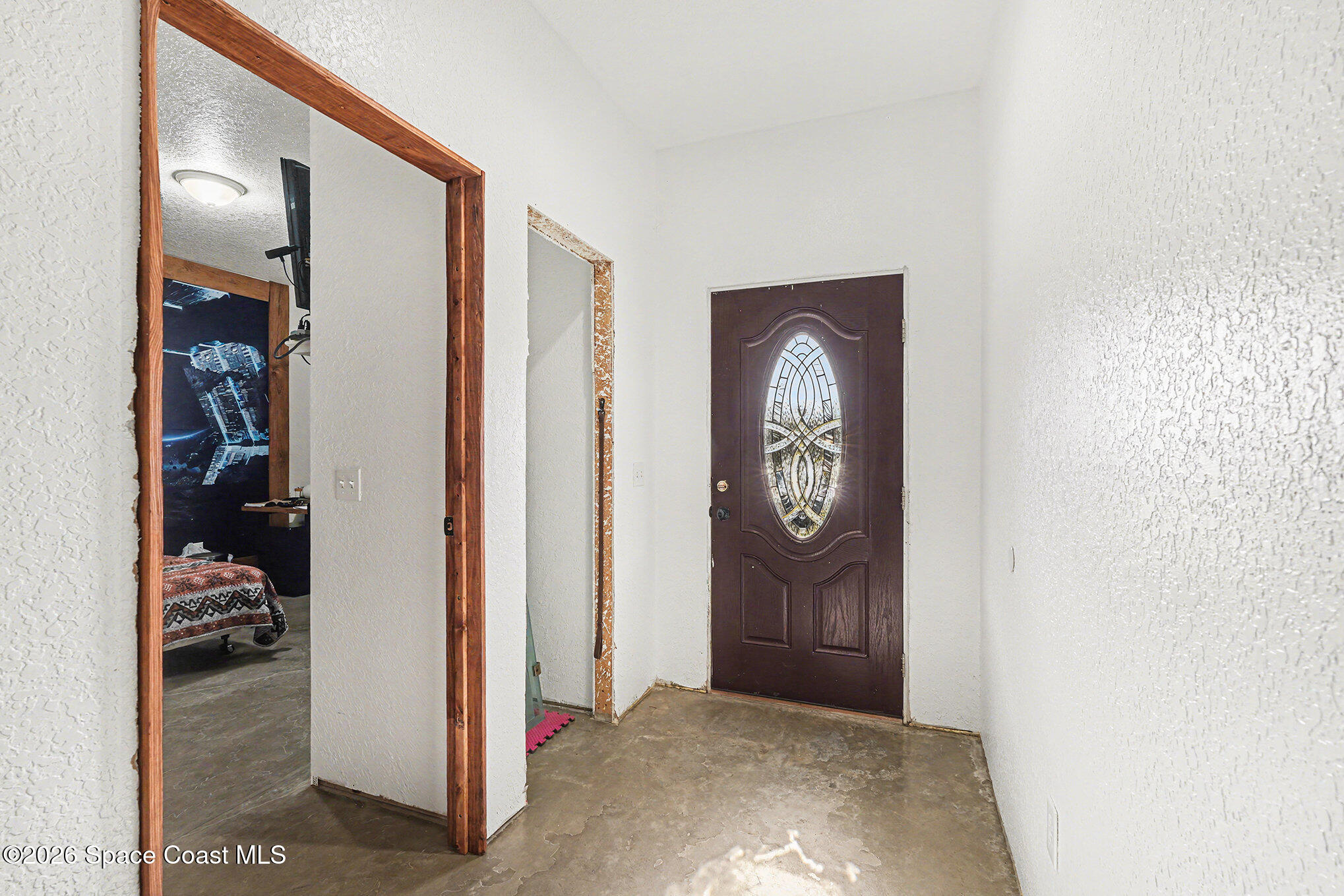4960 Dixie Way Mims, FL 32754 - Photo 10 of 29 a view of entryway with wooden floor