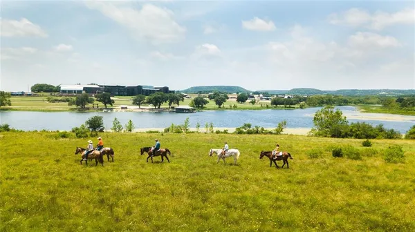 a view of a lake with houses in the back