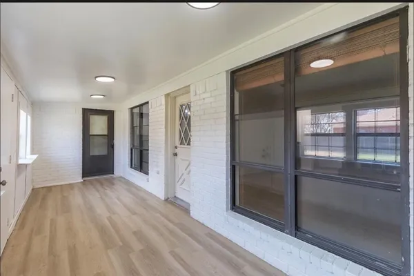 a view of entryway with wooden floor