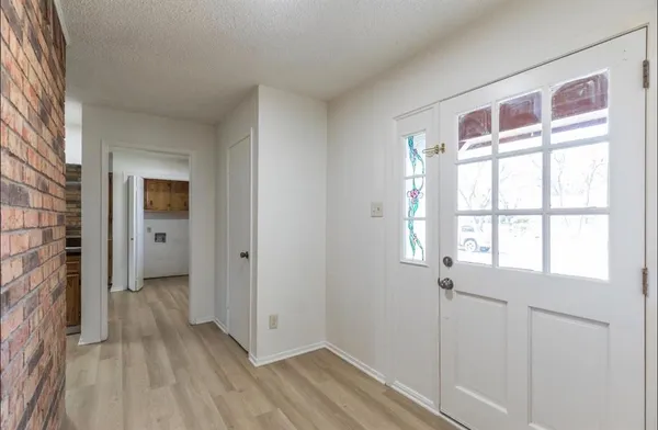 a view of entryway with wooden floor