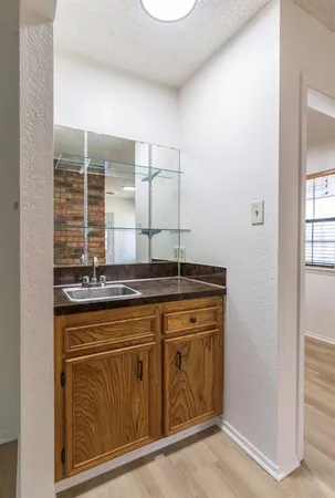 a kitchen with a sink and cabinets