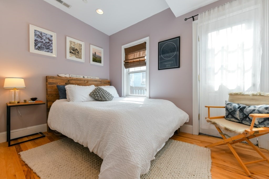 5 Grimes Street, Unit 3 Boston, MA 02127 - Photo 13 of 16 a bedroom with bed and a window