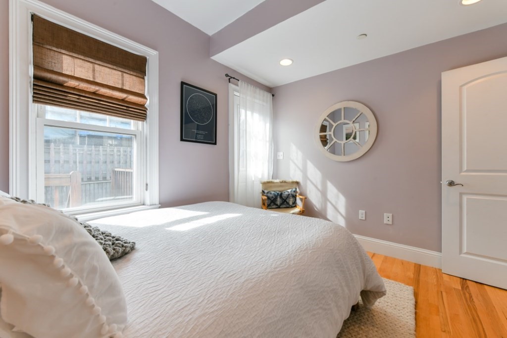 5 Grimes Street, Unit 3 Boston, MA 02127 - Photo 14 of 16 a bedroom with a bed and a window