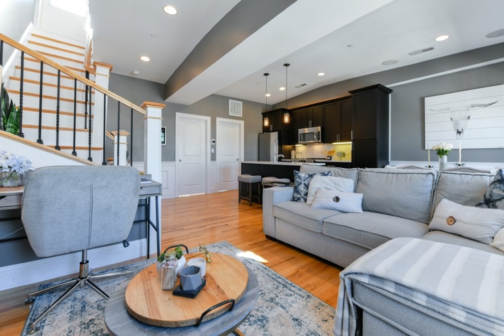 5 Grimes Street, Unit 3 Boston, MA 02127 - Photo 9 of 16 a living room with furniture and a wooden floor