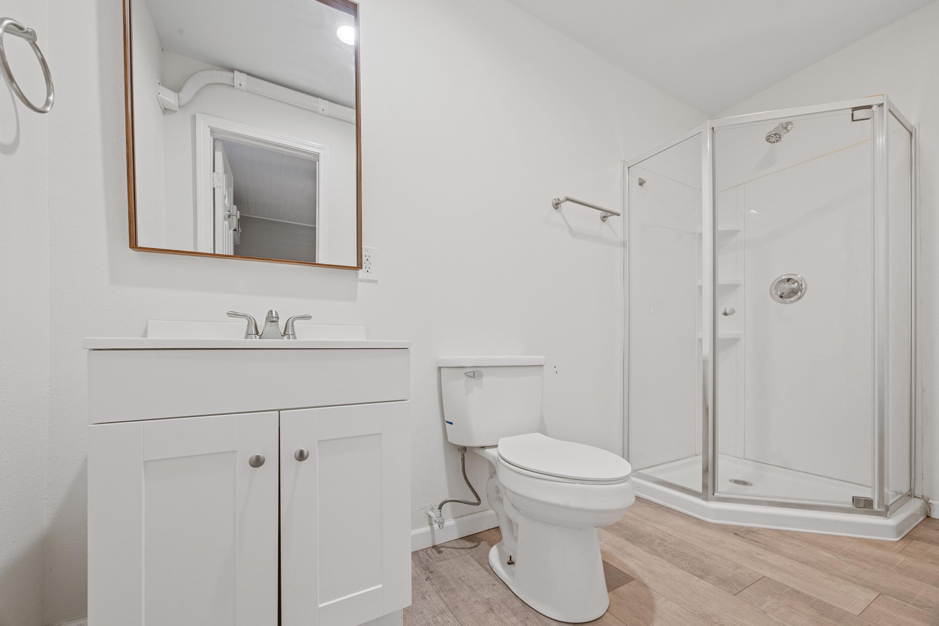 198 East 1st Avenue Crestview, FL 32536 - Photo 21 of 43 a bathroom with a toilet sink and shower