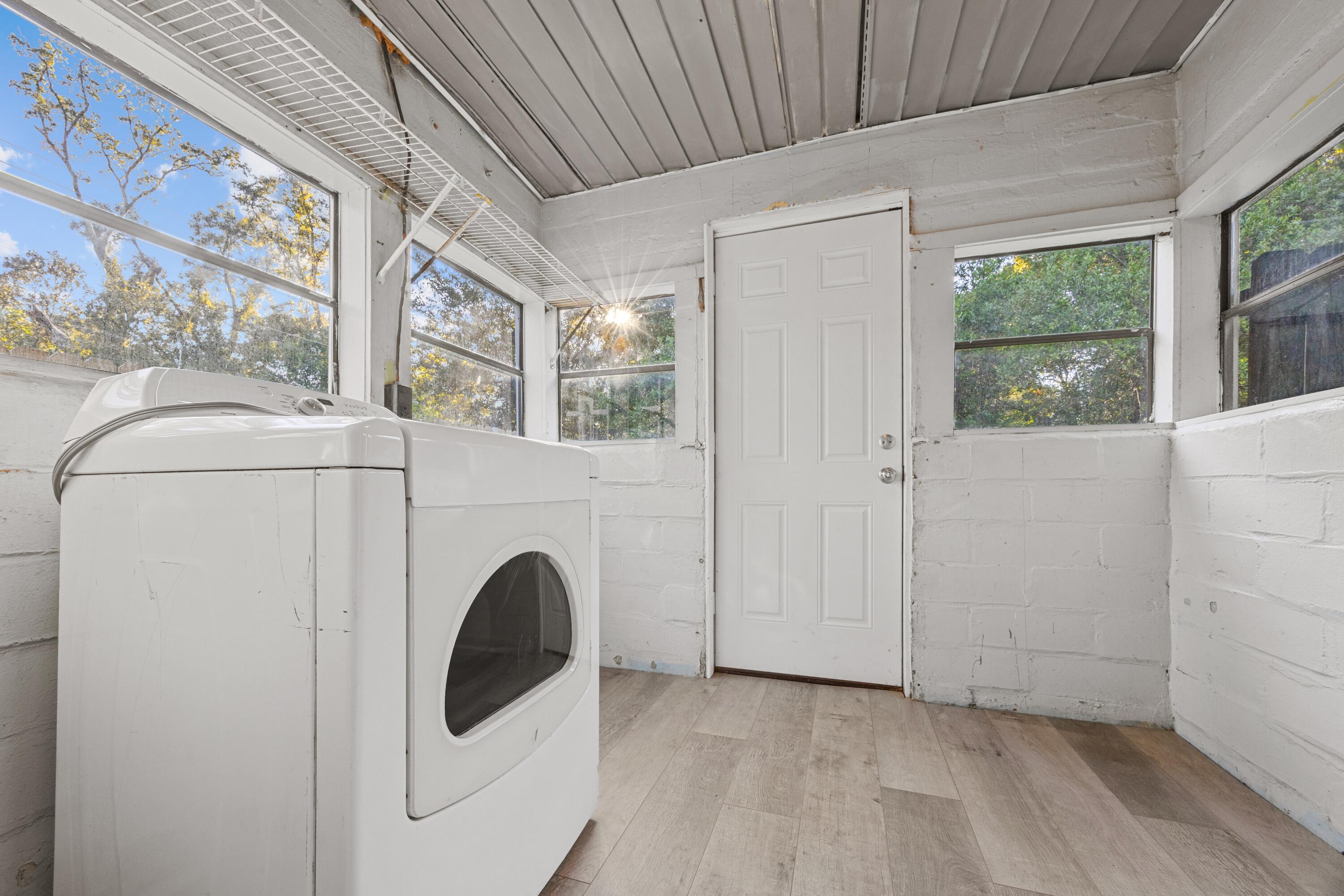 198 East 1st Avenue Crestview, FL 32536 - Photo 23 of 43 a view of a hallway with washer and dryer