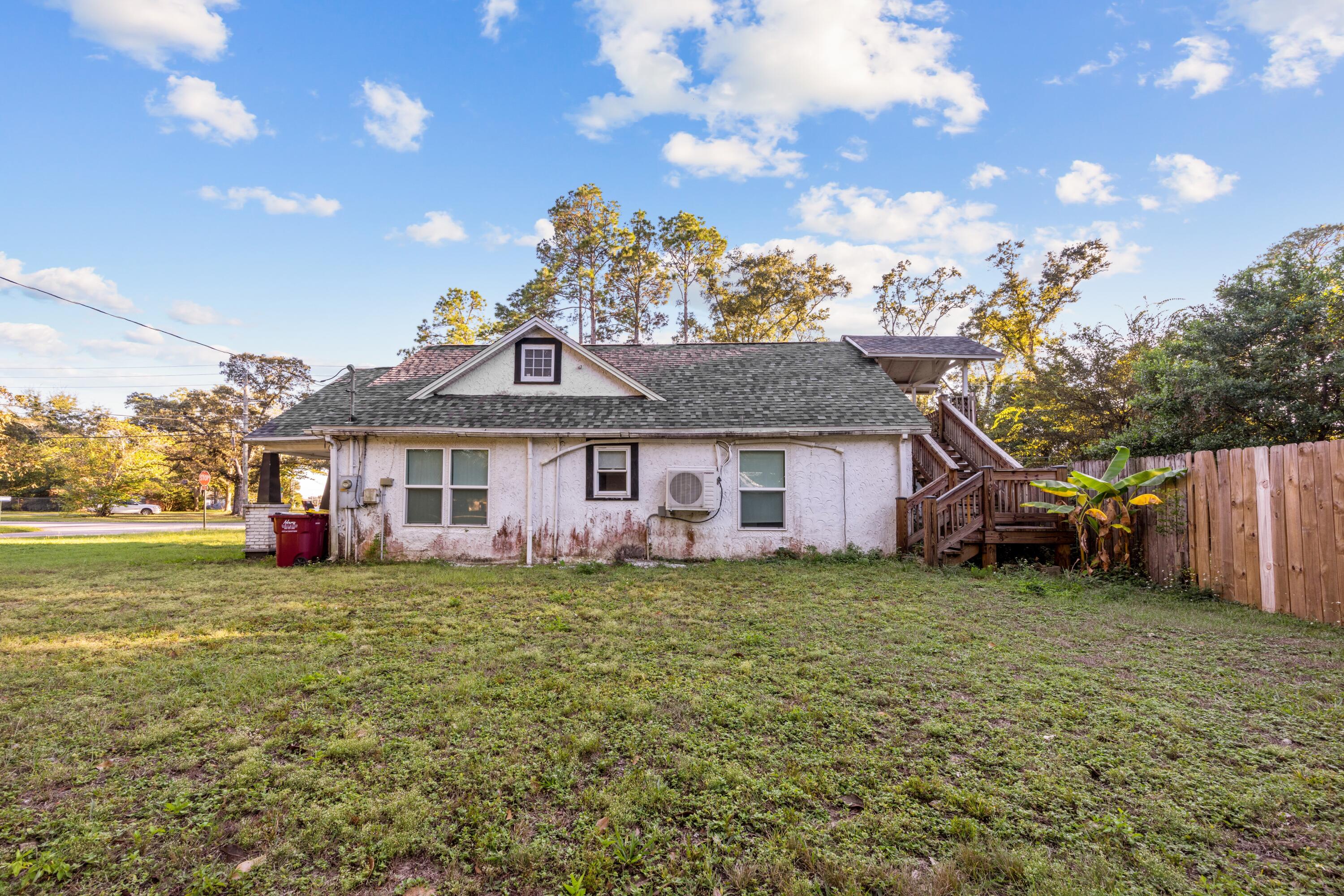 198 East 1st Avenue Crestview, FL 32536 - Photo 28 of 43 a front view of a house with a garden
