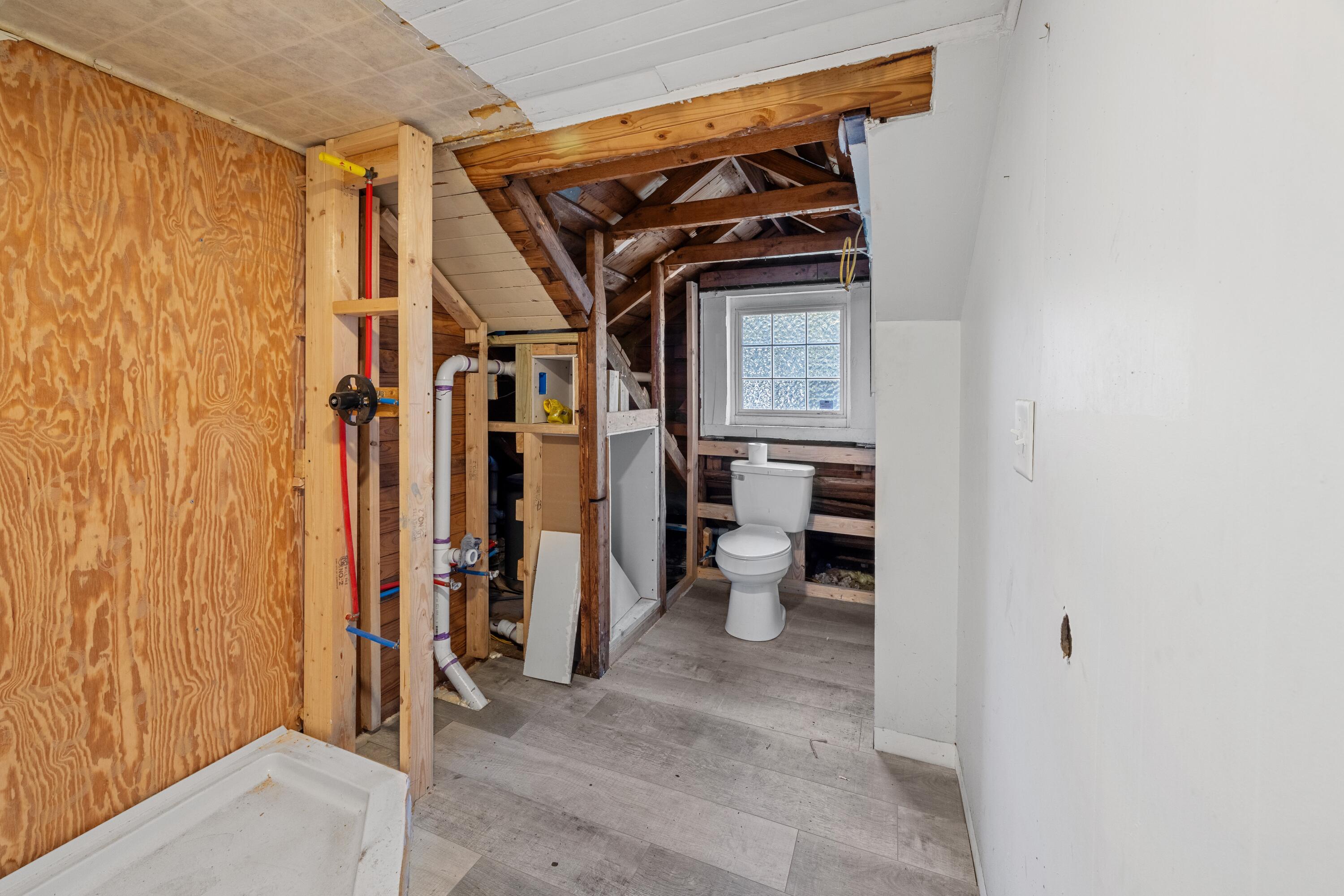 198 East 1st Avenue Crestview, FL 32536 - Photo 34 of 43 a view of walk in closet with clothes and shoes