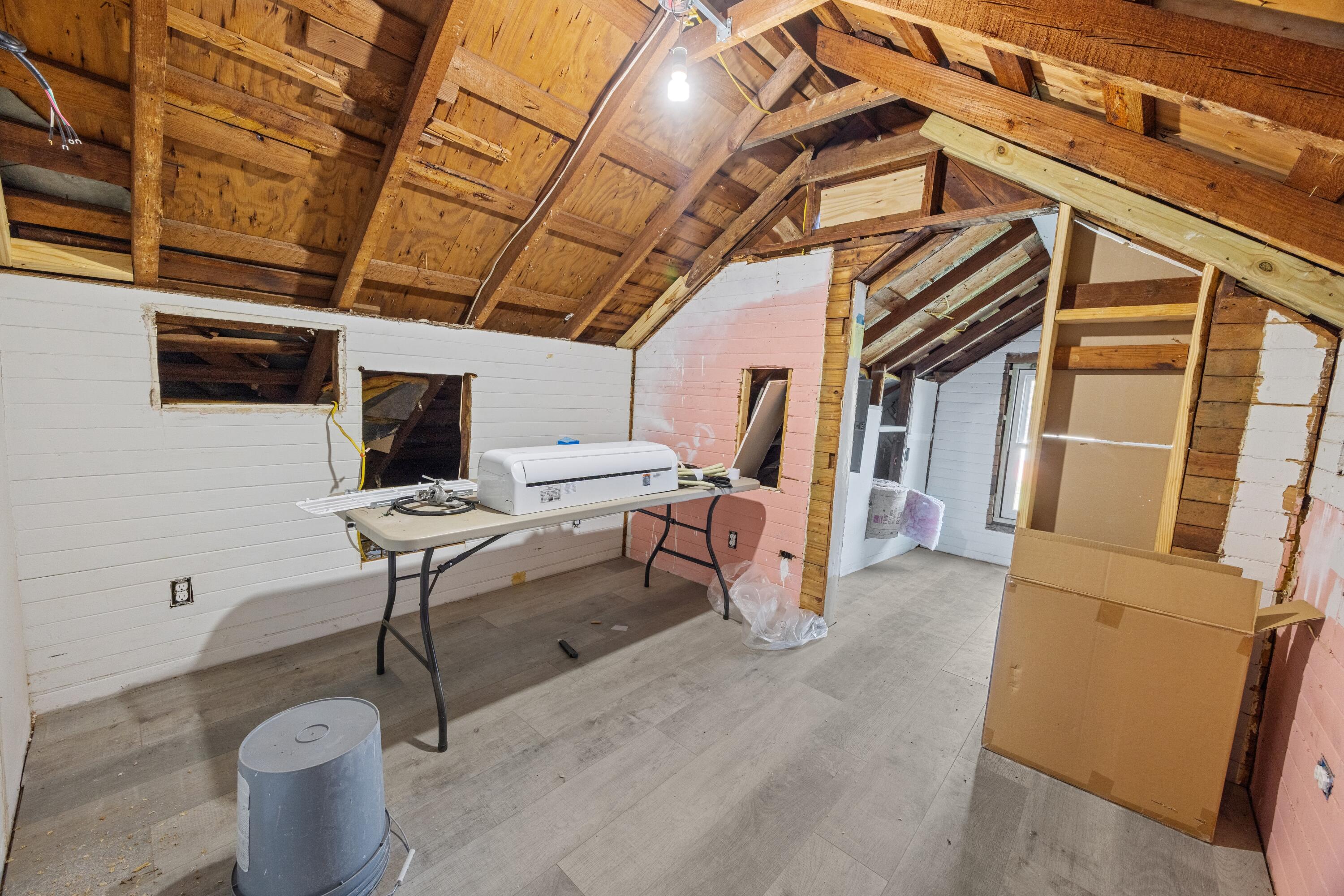 198 East 1st Avenue Crestview, FL 32536 - Photo 36 of 43 a living room with furniture and a flat screen tv
