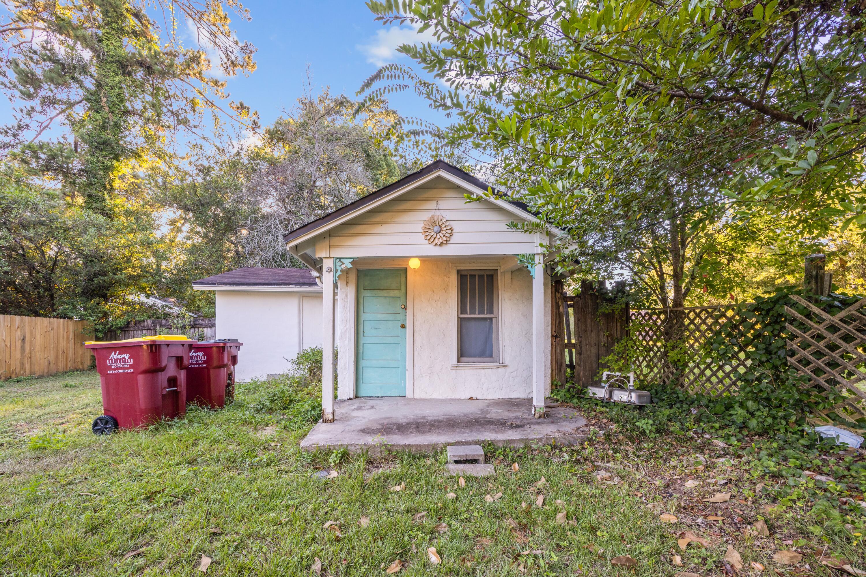 198 East 1st Avenue Crestview, FL 32536 - Photo 40 of 43 a front view of a house with yard