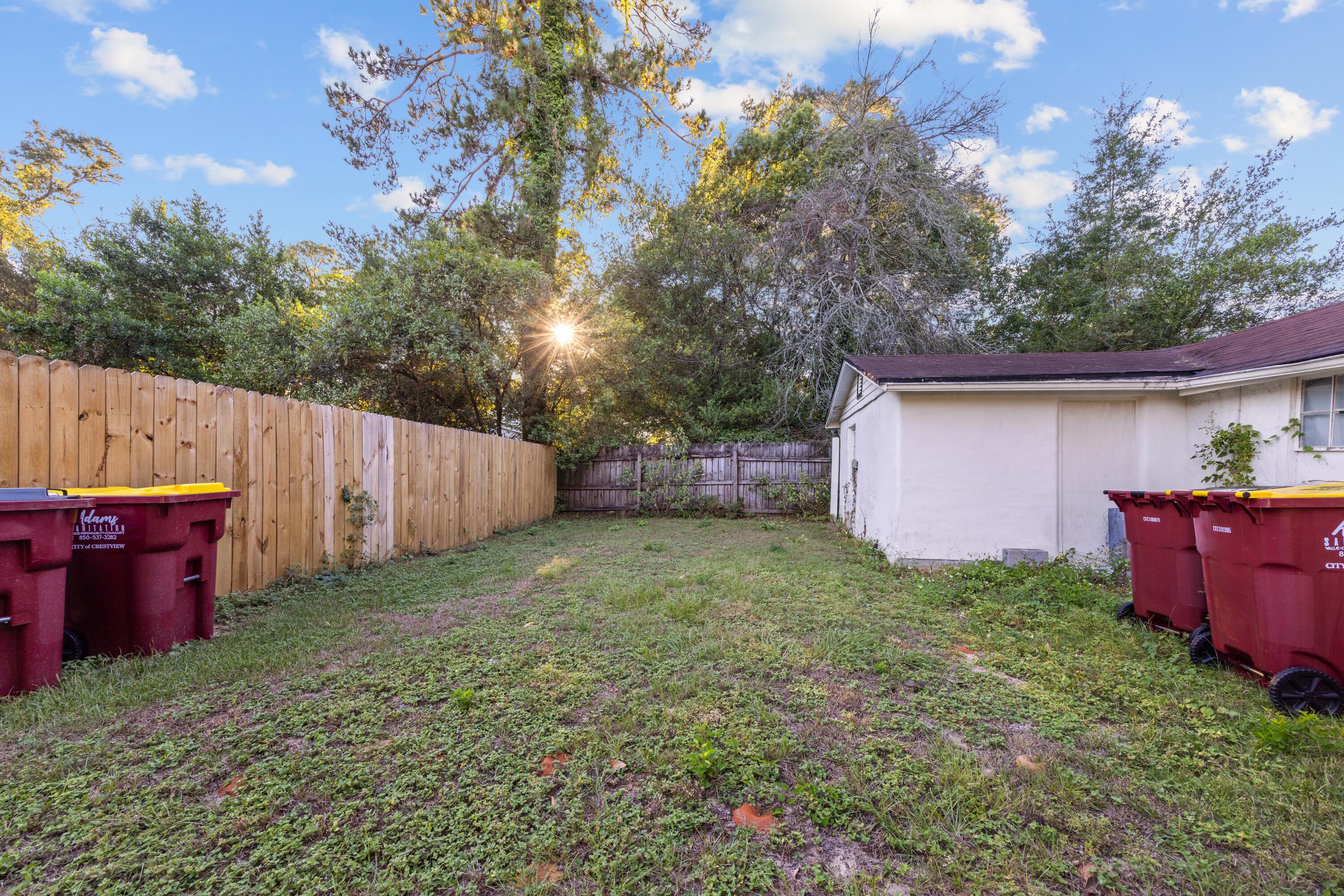 198 East 1st Avenue Crestview, FL 32536 - Photo 43 of 43 a backyard of a house with lots of green space