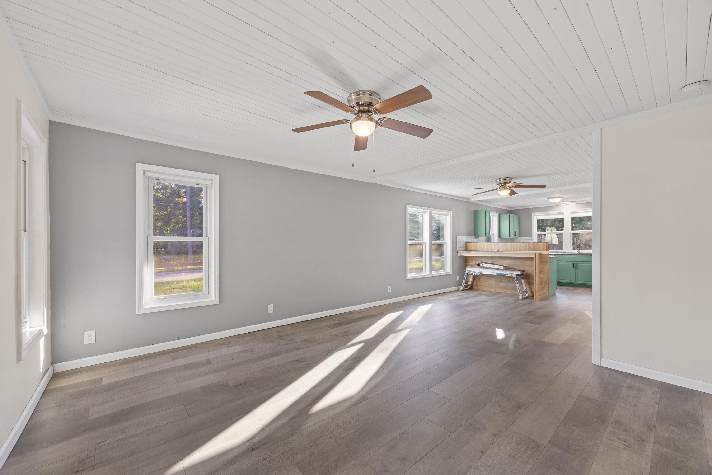 198 East 1st Avenue Crestview, FL 32536 - Photo 6 of 43 a living room with furniture and window