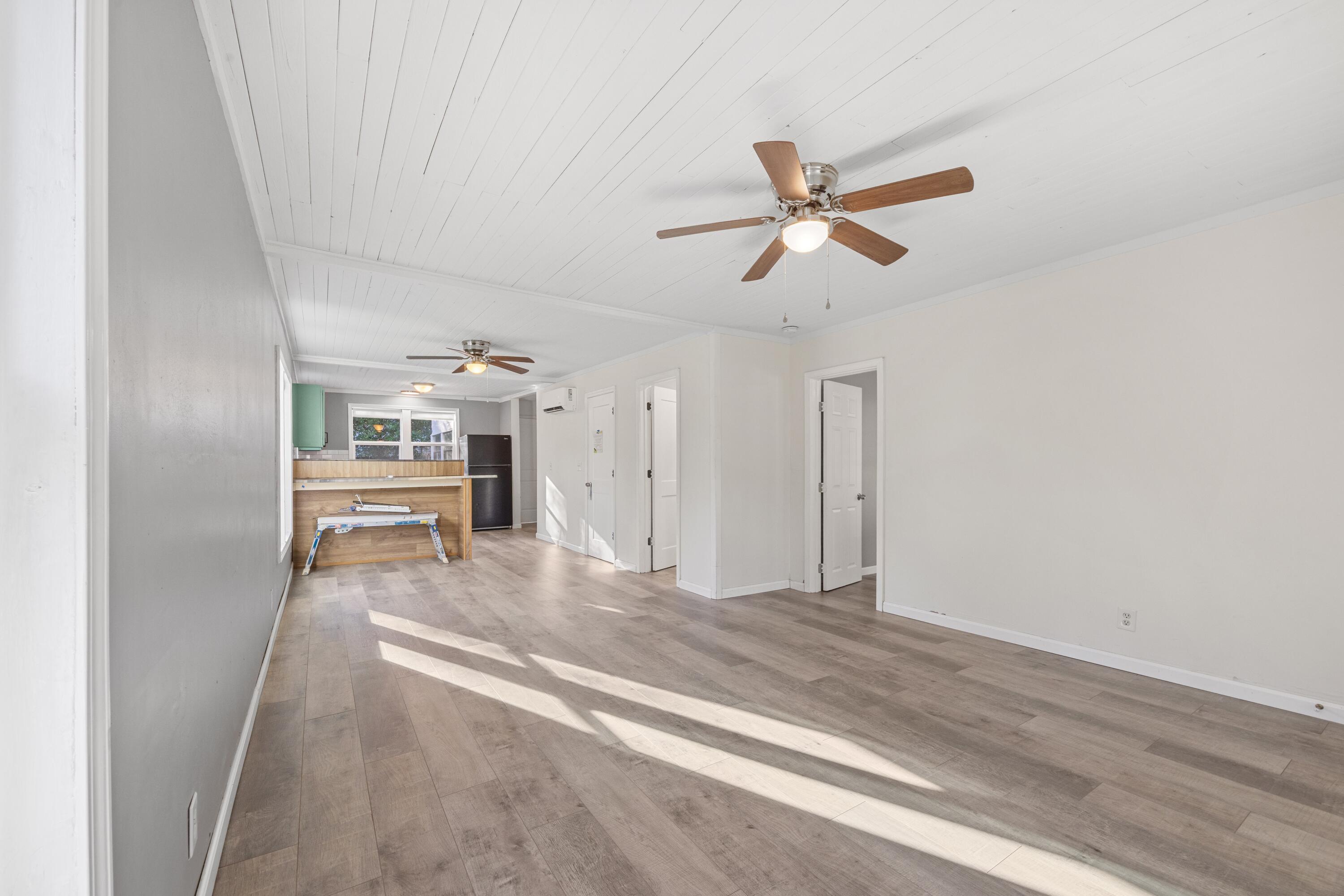 198 East 1st Avenue Crestview, FL 32536 - Photo 7 of 43 a living room with furniture and a ceiling fan