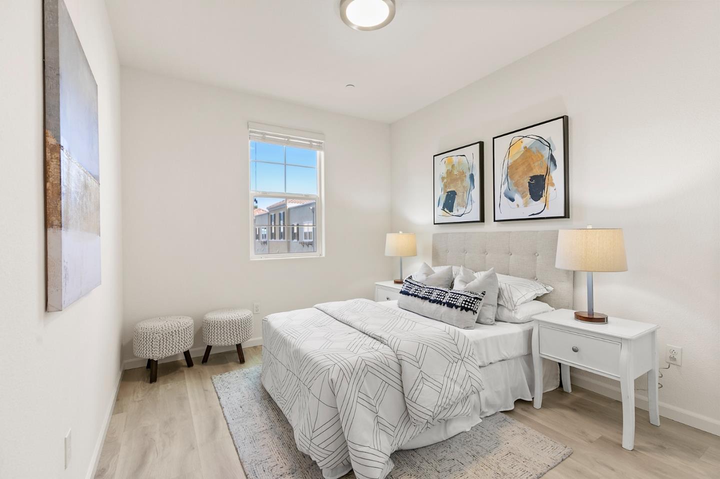 39829 Pelton Terrace Newark, CA 94560 - Photo 16 of 20 a bedroom with a bed and a lamp on table