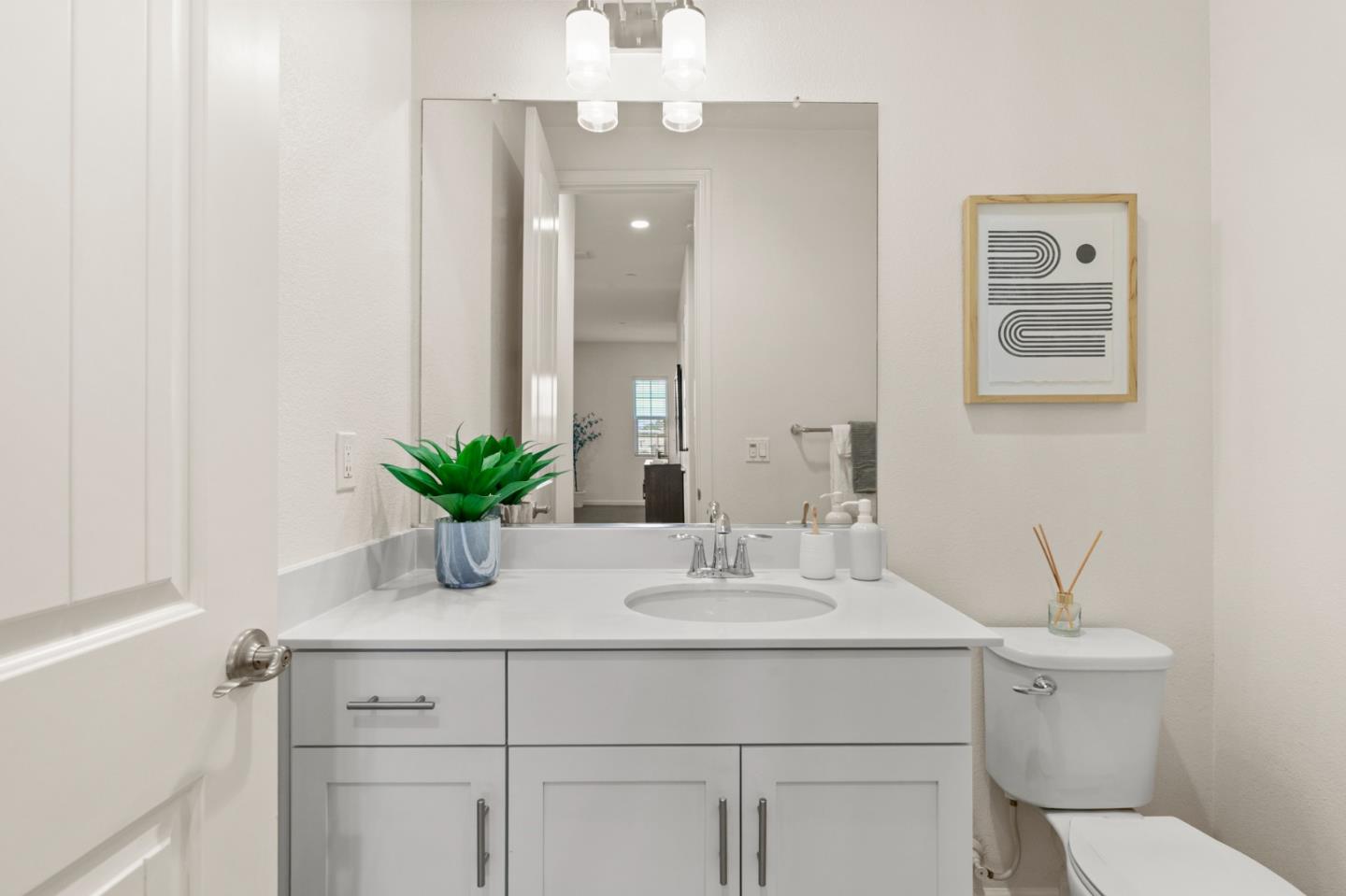 39829 Pelton Terrace Newark, CA 94560 - Photo 10 of 20 a bathroom with a sink a toilet and mirror
