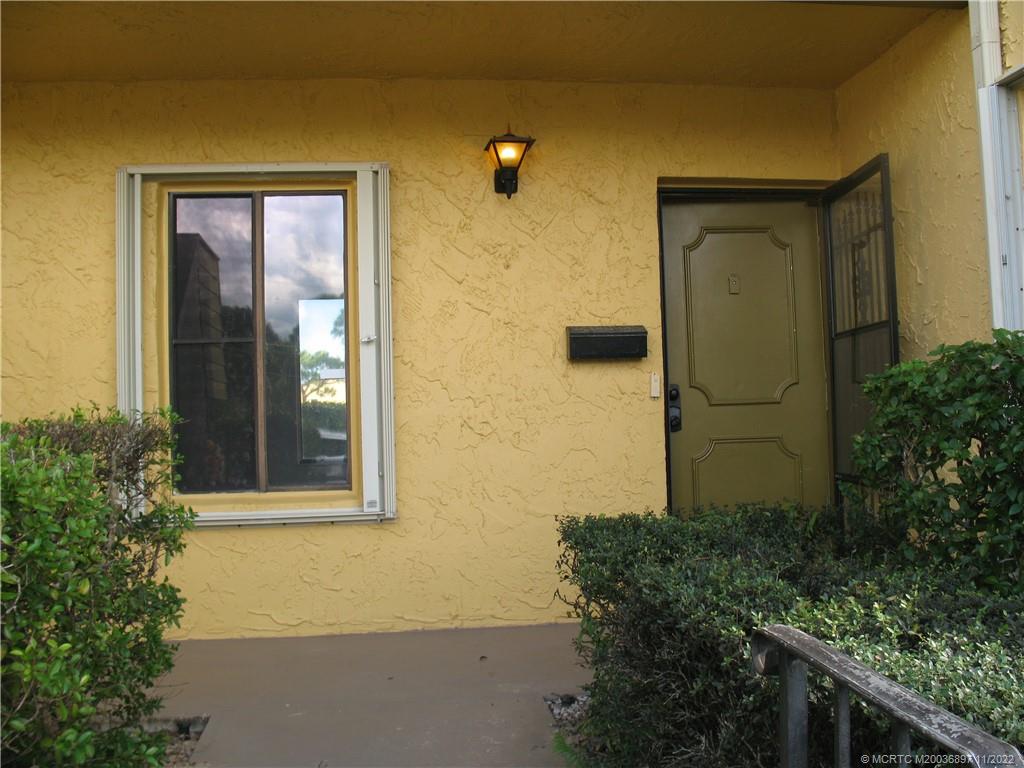 5393 Southeast Miles Grant Road, Unit A103 Stuart, FL 34997 - Photo 1 of 20 Close up of entry way