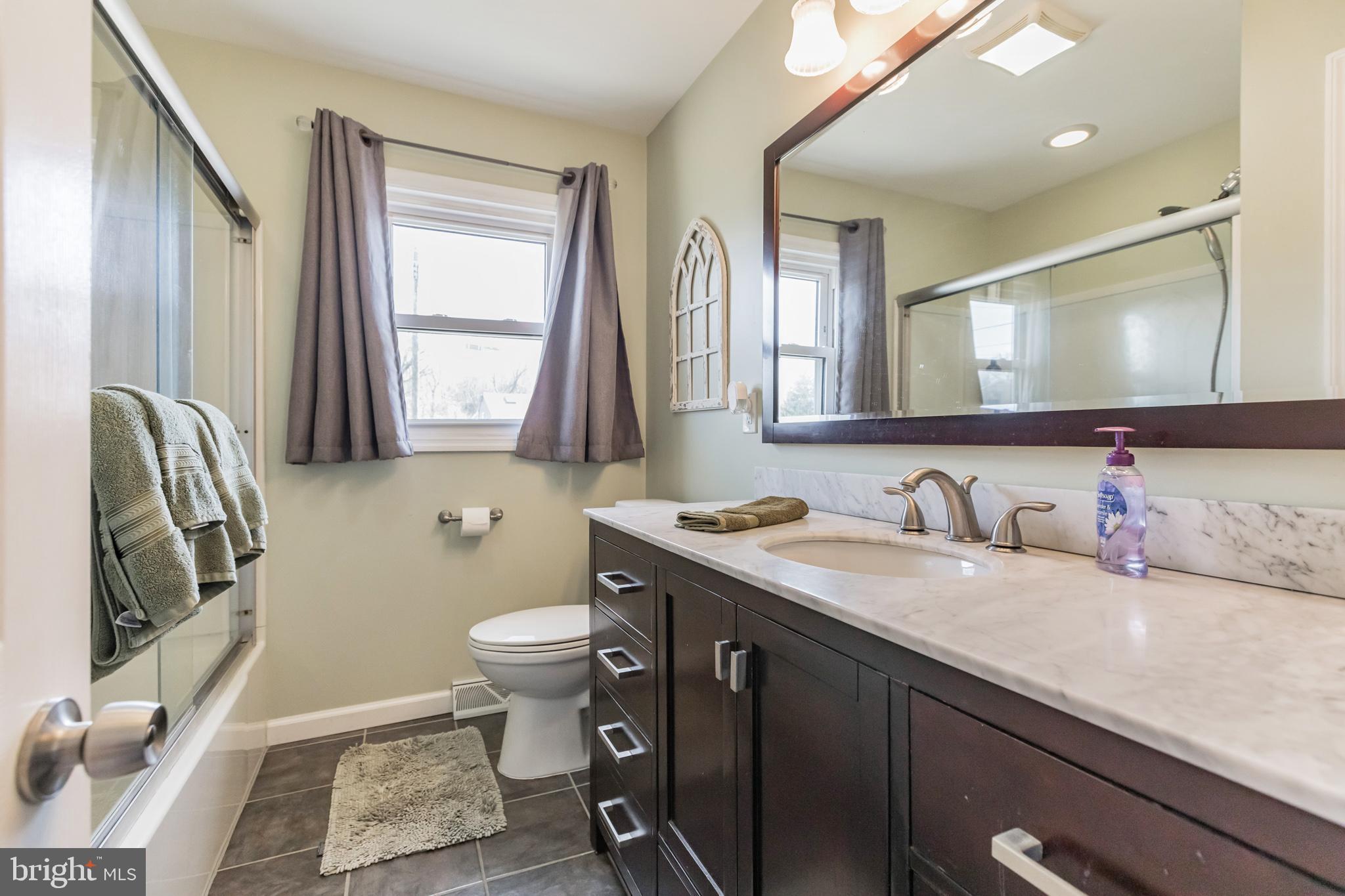 27 Boswell Road Marlton, NJ 08053 - Photo 13 of 40 a bathroom with a granite countertop sink mirror vanity and toilet