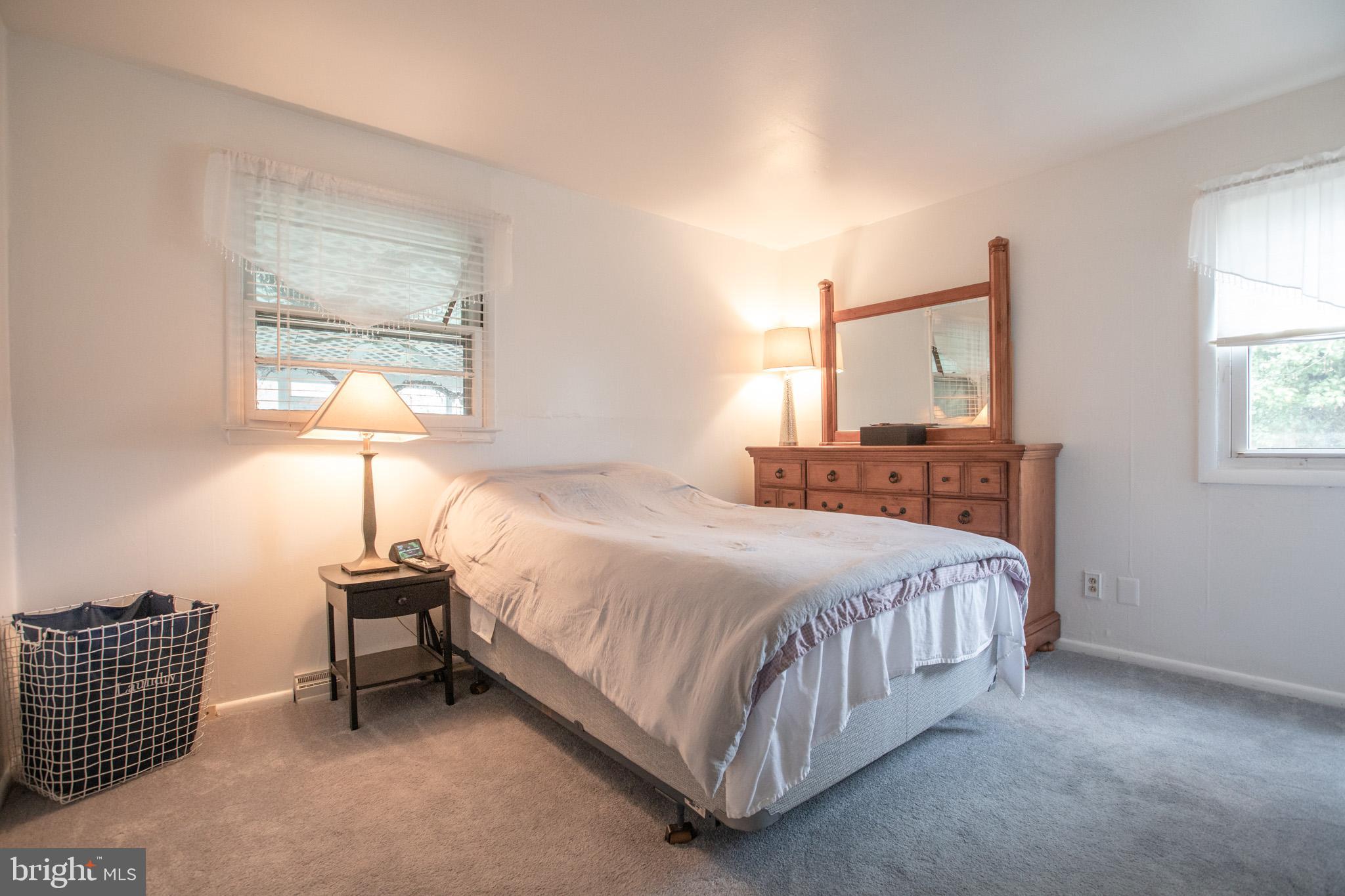 27 Boswell Road Marlton, NJ 08053 - Photo 14 of 40 a bedroom with a bed table and a window