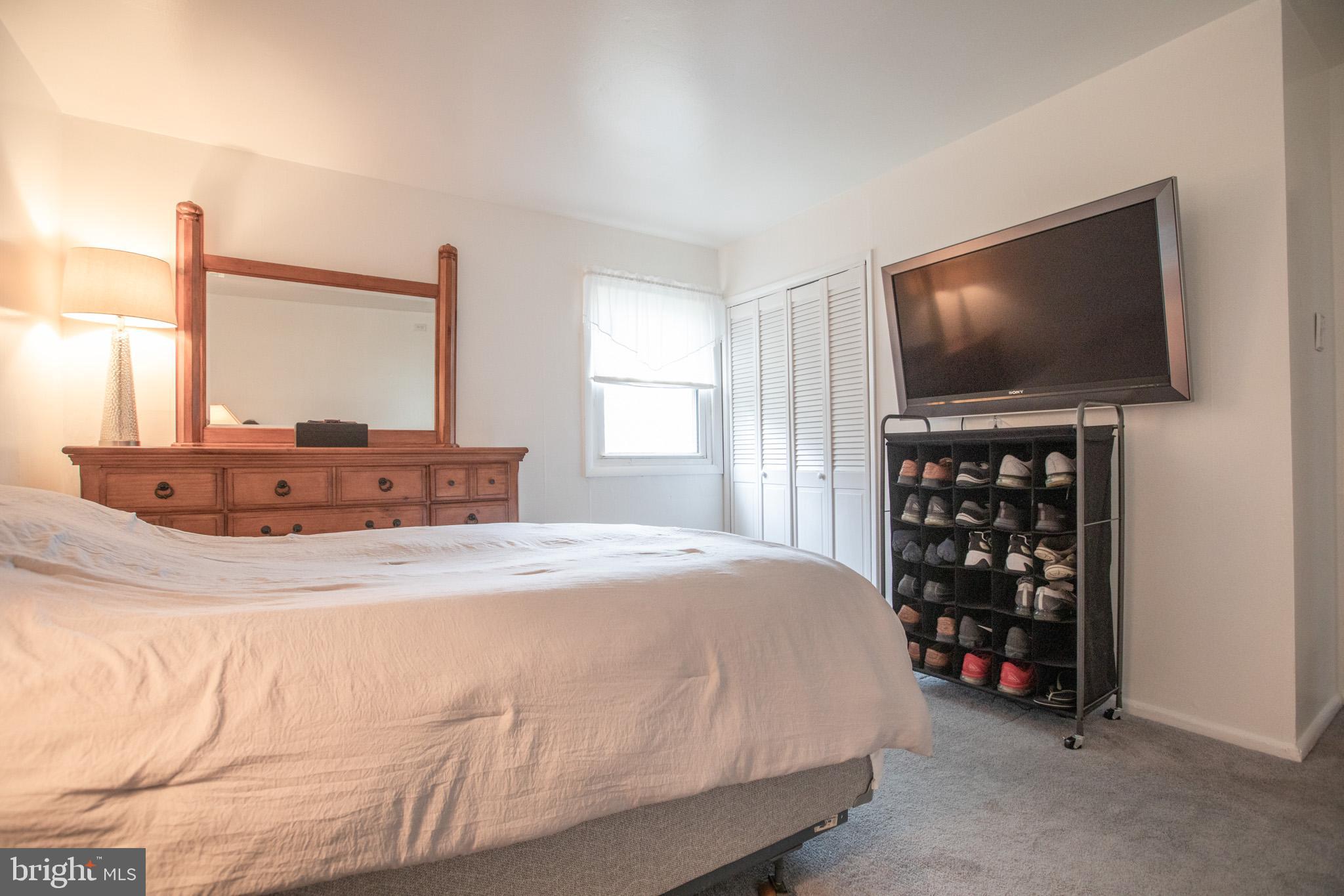27 Boswell Road Marlton, NJ 08053 - Photo 15 of 40 a bedroom with a bed and a flat screen tv