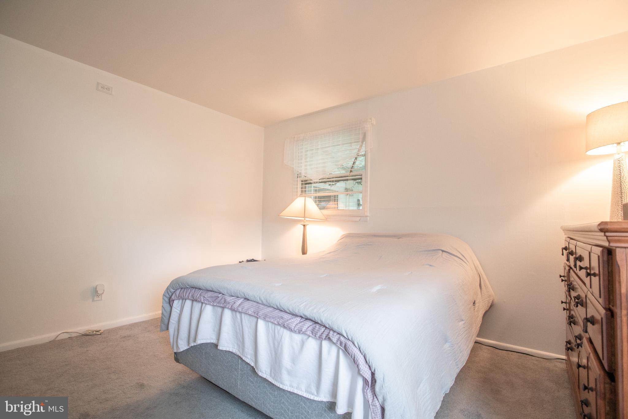 27 Boswell Road Marlton, NJ 08053 - Photo 16 of 40 a bedroom with a bed and a window