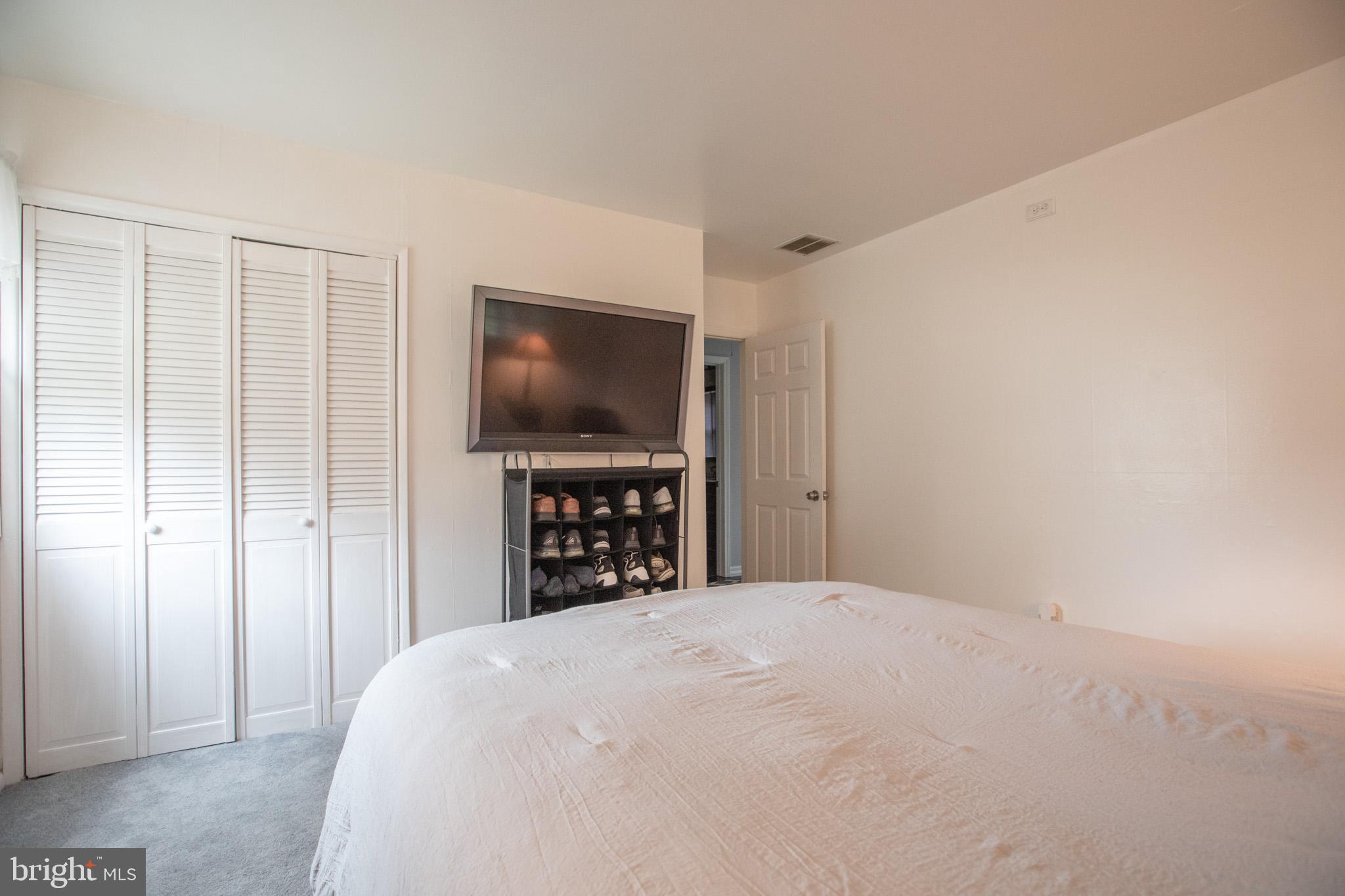 27 Boswell Road Marlton, NJ 08053 - Photo 17 of 40 a bedroom with a bed and a flat screen tv