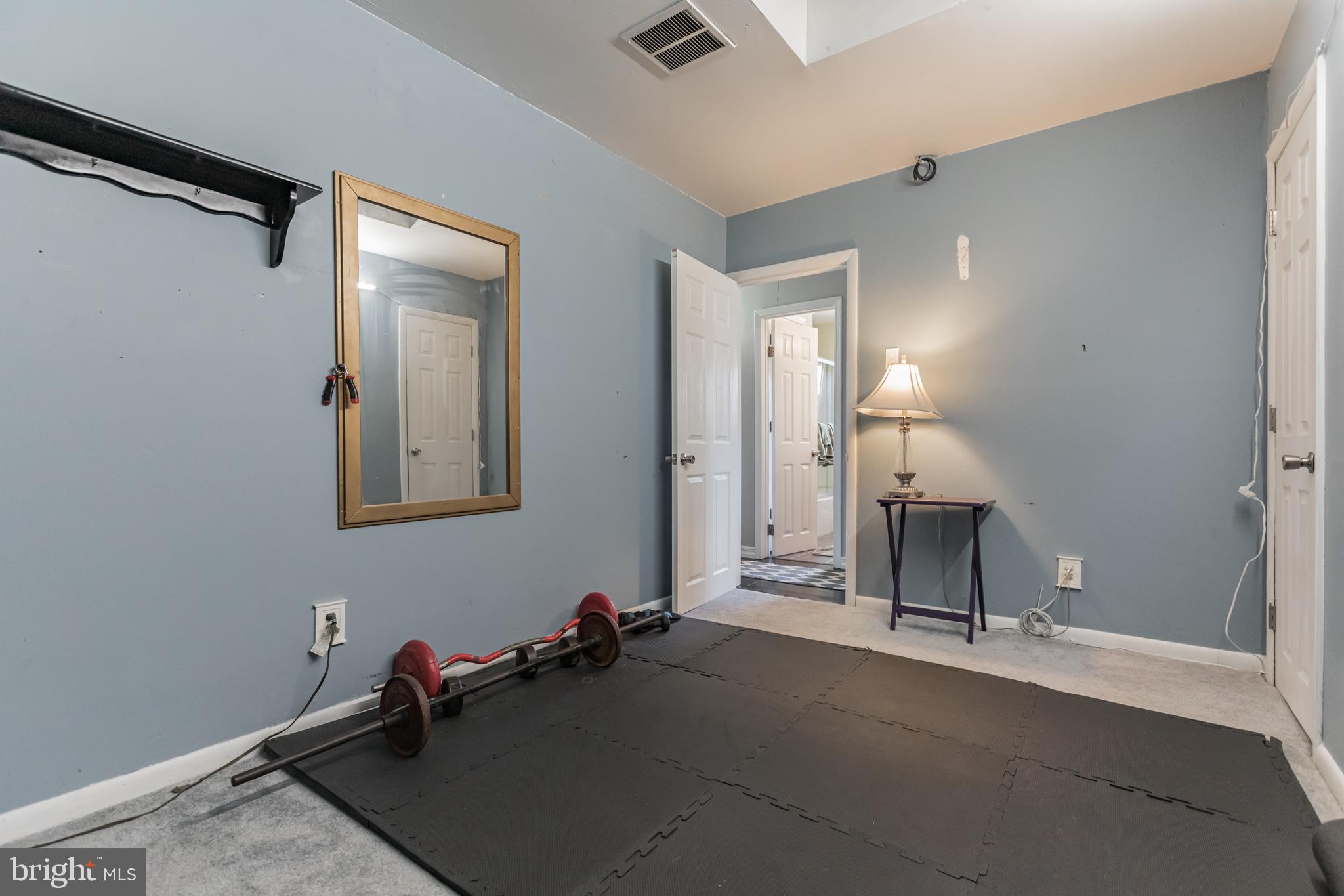27 Boswell Road Marlton, NJ 08053 - Photo 20 of 40 a room with gym equipment and view of living room