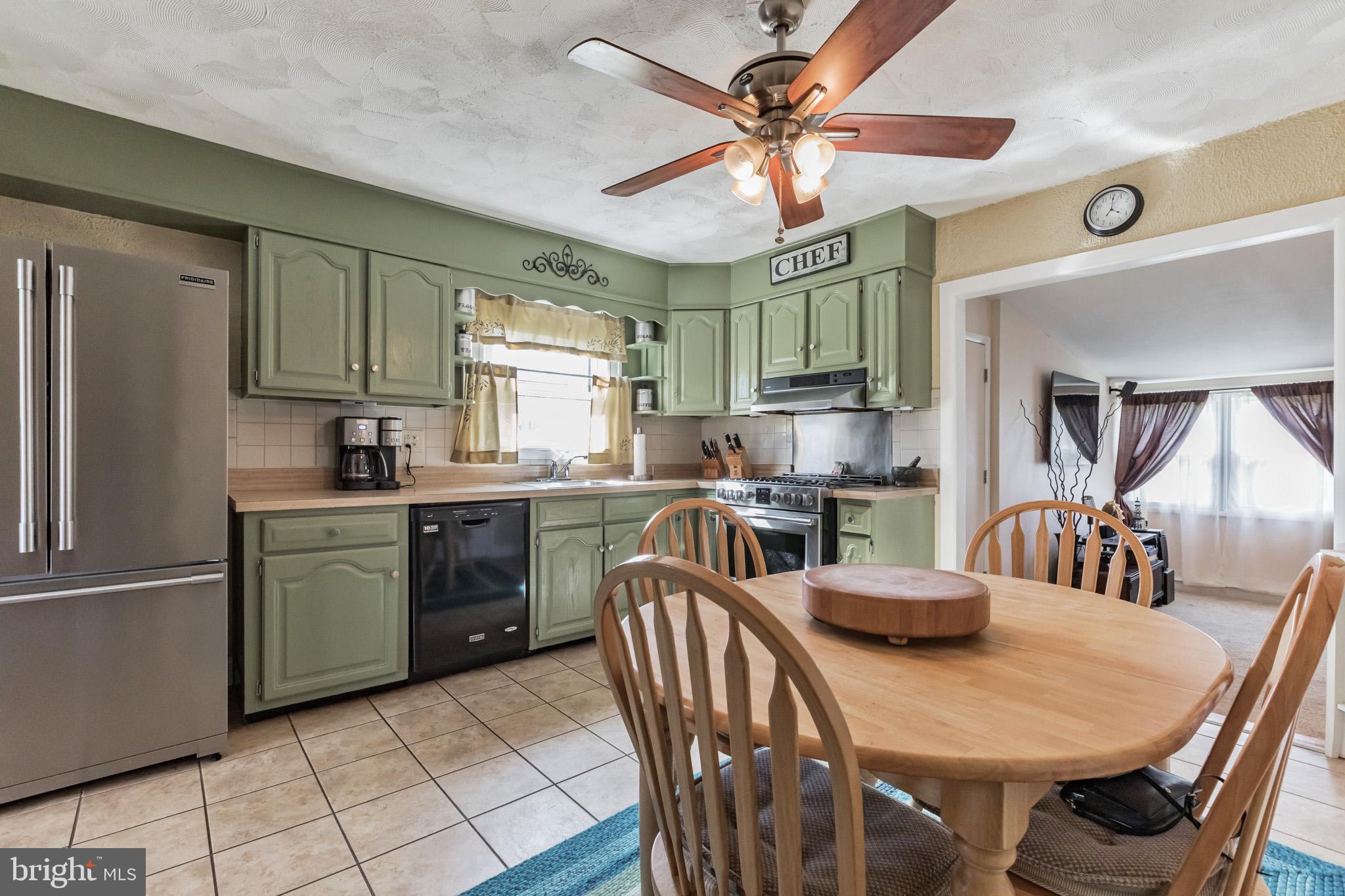 27 Boswell Road Marlton, NJ 08053 - Photo 26 of 40 a kitchen with a dining table chairs stainless steel appliances and cabinets