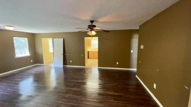 67 Appling Road Eufaula, AL 36027 - Photo 13 of 20 Spacious interior featuring dark wood-finish flooring, recessed lighting, ceiling fan, and multiple windows