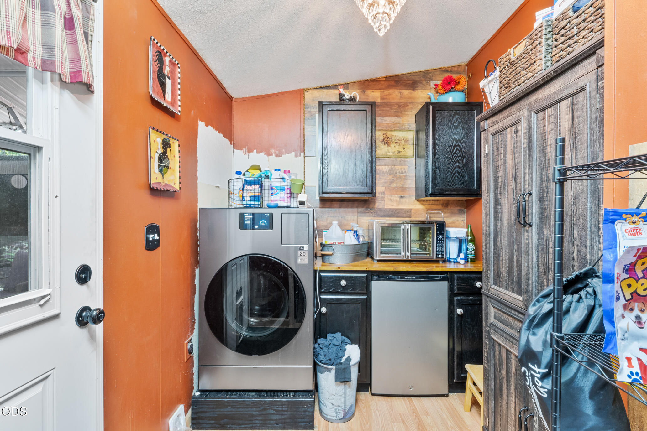 690 Foots Creek Road Gold Hill, OR 97525 - Photo 17 of 45 a utility room with cabinets dryer and washer