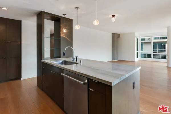 a bathroom with a sink a vanity and a large mirror