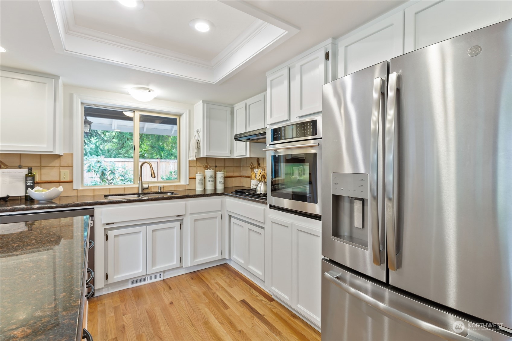 21020 49th Avenue Southeast Bothell, WA 98021 - Photo 12 of 39 a kitchen with stainless steel appliances a refrigerator sink and microwave