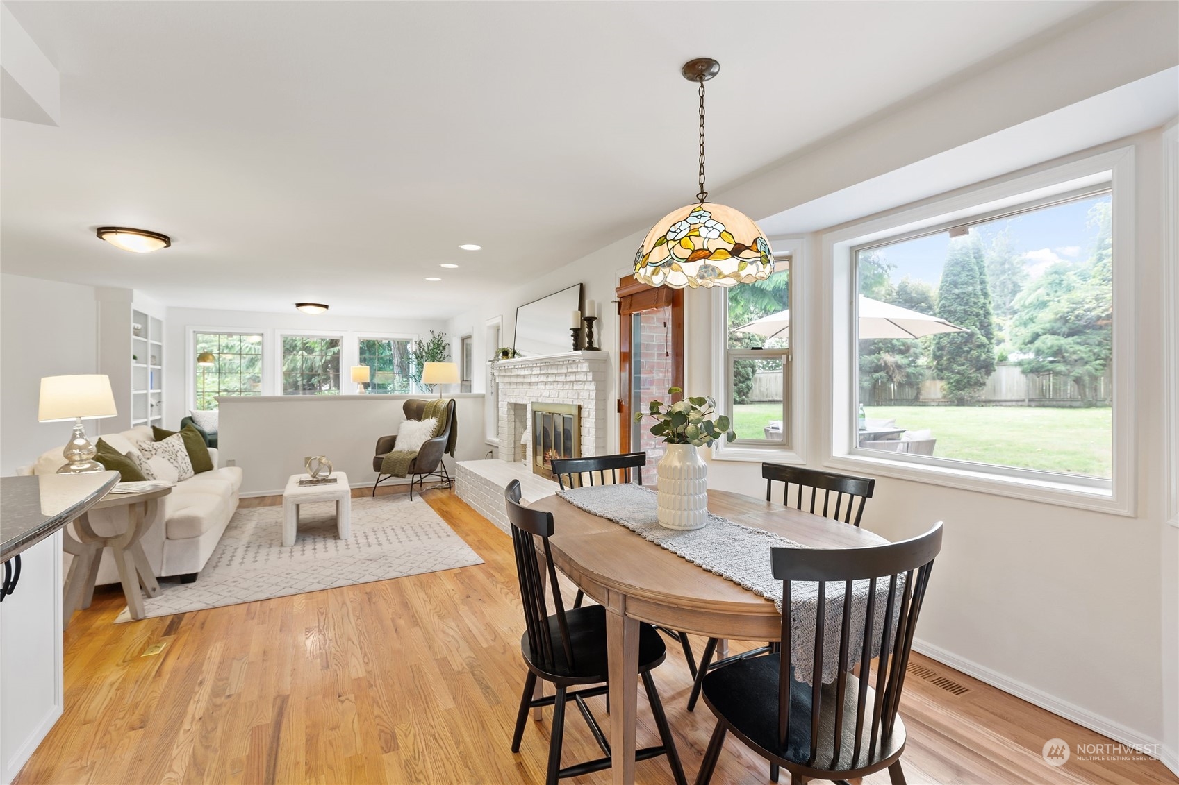 21020 49th Avenue Southeast Bothell, WA 98021 - Photo 14 of 39 a view of a dining room with furniture wooden floor and chandelier