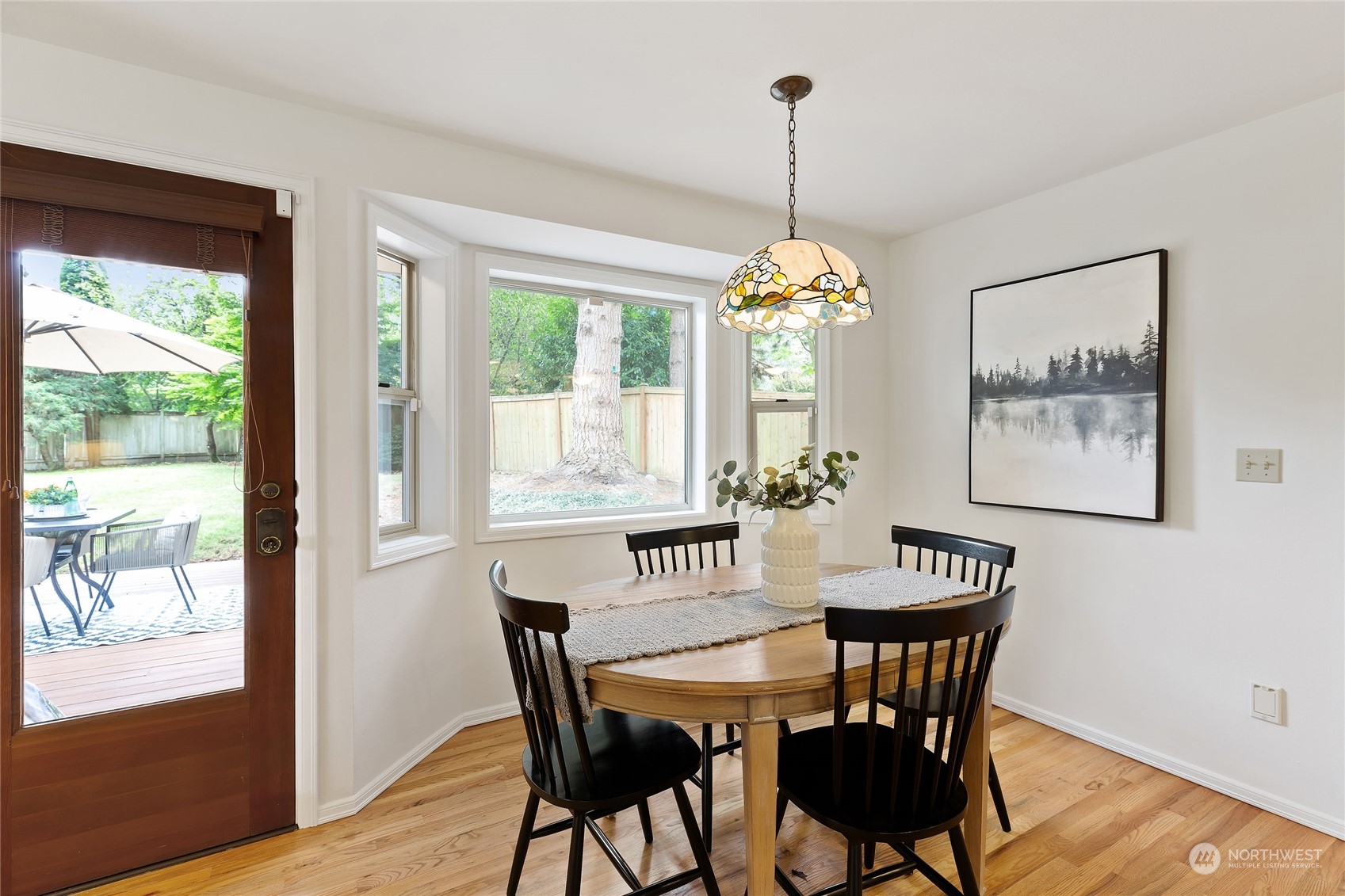 21020 49th Avenue Southeast Bothell, WA 98021 - Photo 15 of 39 a view of a dining room with furniture window and wooden floor