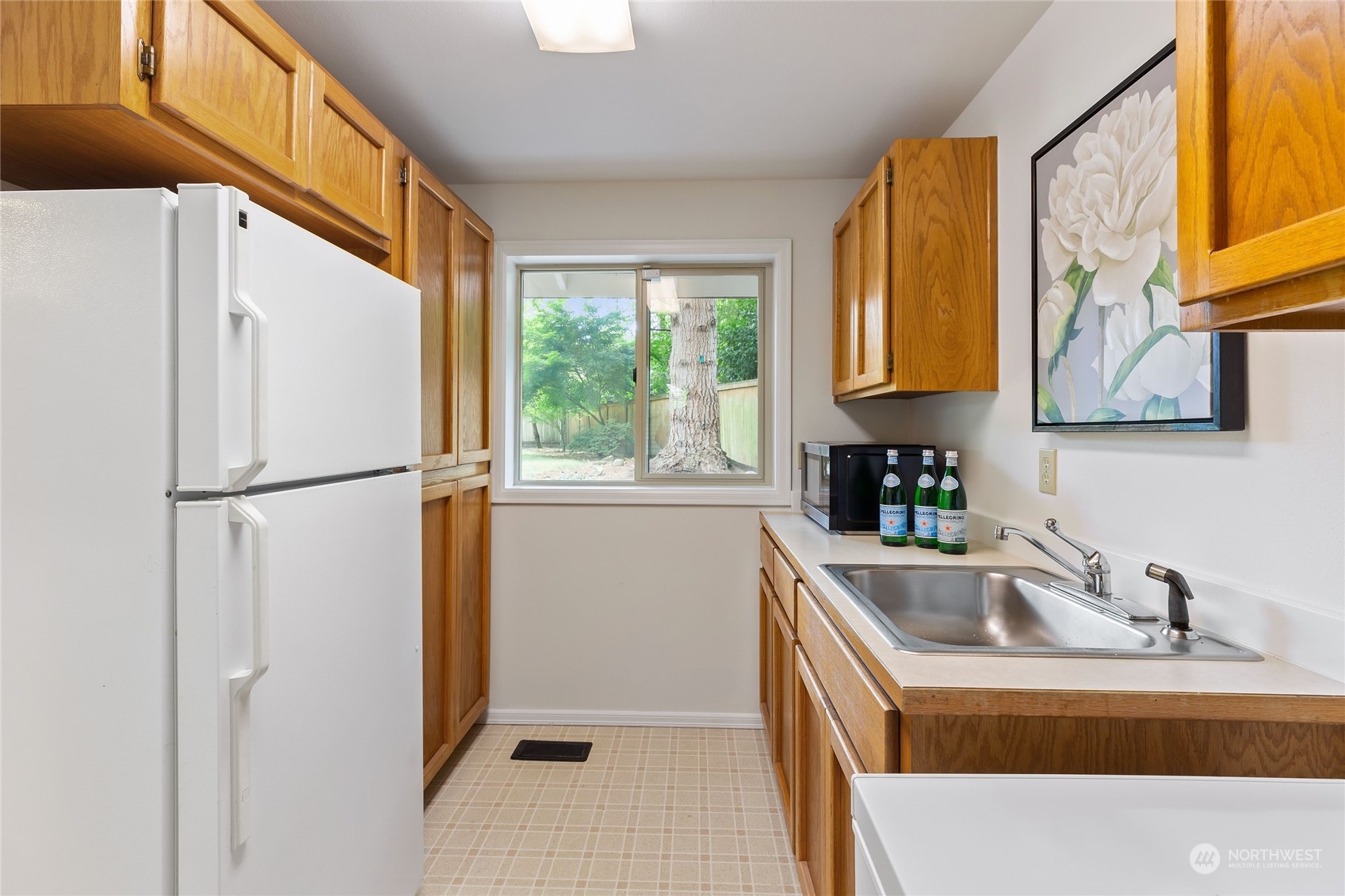 21020 49th Avenue Southeast Bothell, WA 98021 - Photo 16 of 39 a kitchen with stainless steel appliances granite countertop a refrigerator and a sink