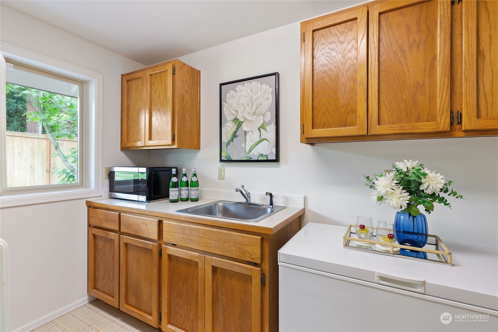 21020 49th Avenue Southeast Bothell, WA 98021 - Photo 17 of 39 a kitchen with a sink cabinets and window