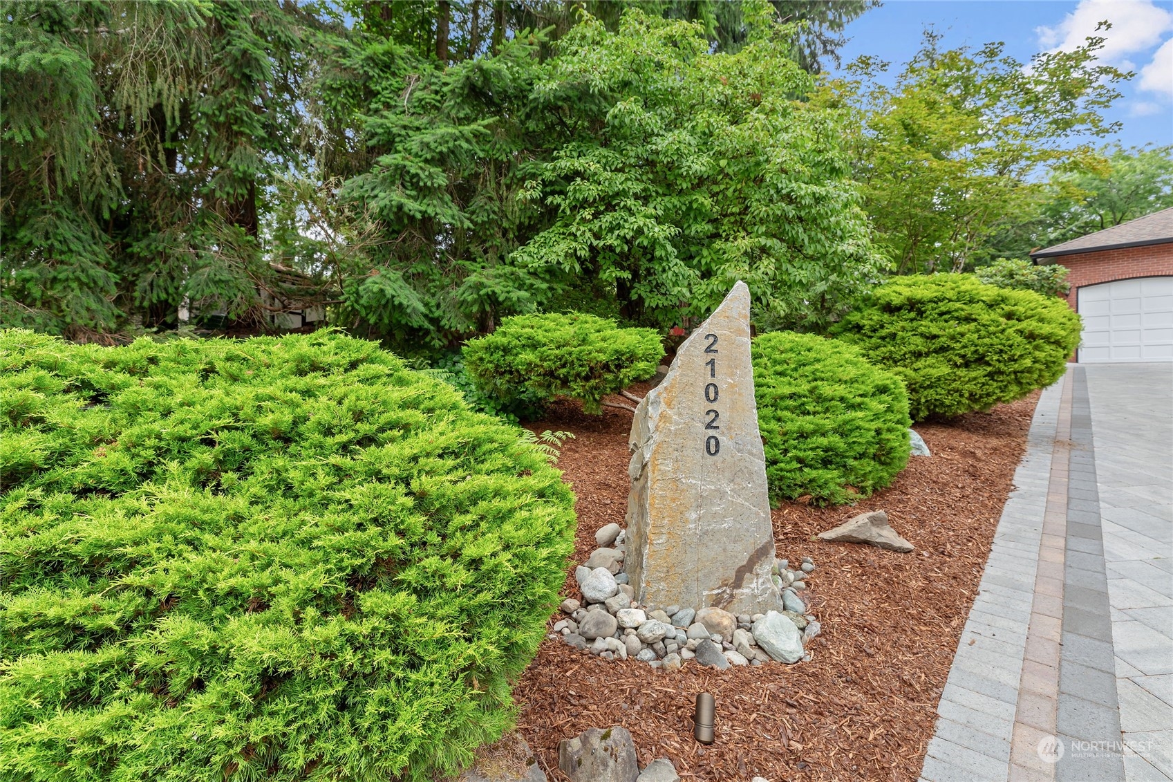 21020 49th Avenue Southeast Bothell, WA 98021 - Photo 2 of 39 a view of a garden with large trees