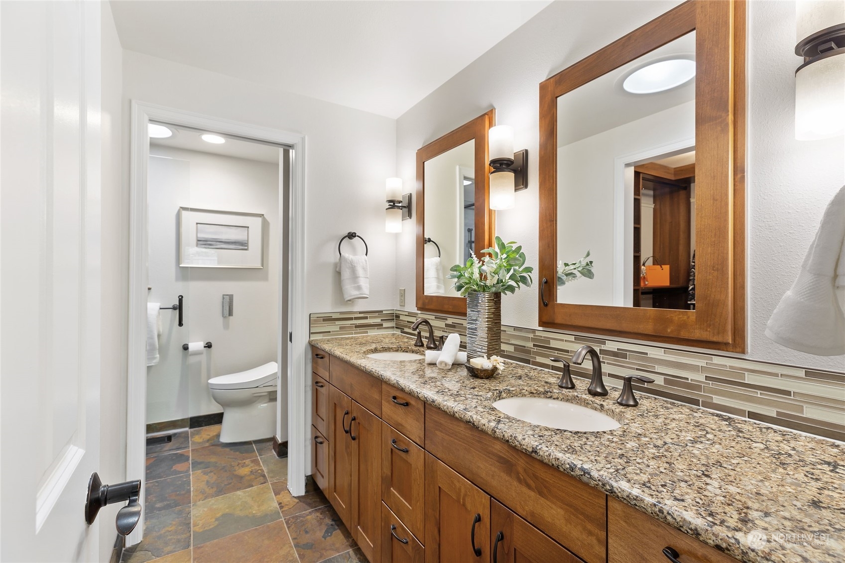 21020 49th Avenue Southeast Bothell, WA 98021 - Photo 27 of 39 a bathroom with a granite countertop sink and a large mirror