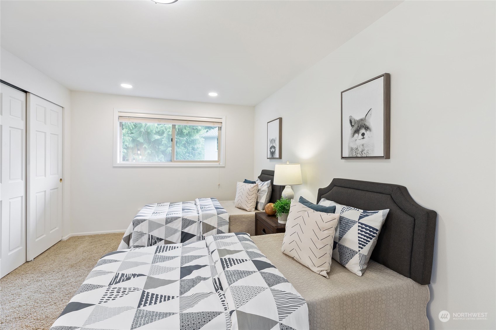 21020 49th Avenue Southeast Bothell, WA 98021 - Photo 30 of 39 a bedroom with a bed and wooden floor