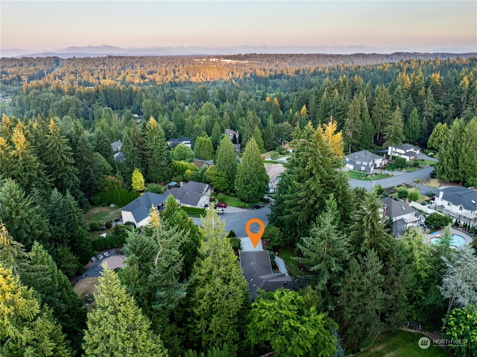 21020 49th Avenue Southeast Bothell, WA 98021 - Photo 3 of 39 an aerial view of a city with lots of residential buildings and mountain view in back