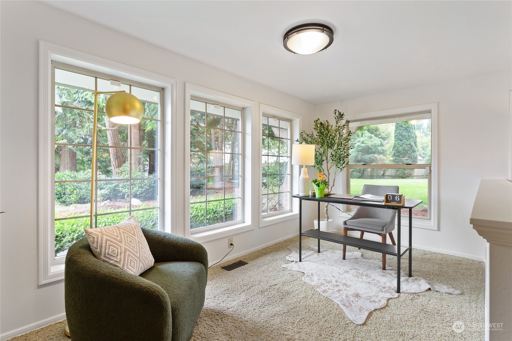 21020 49th Avenue Southeast Bothell, WA 98021 - Photo 8 of 39 a living room with furniture and a large window