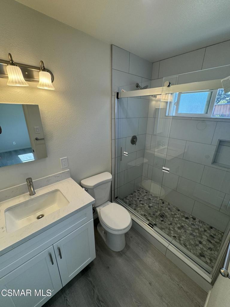 1769 Sitka Avenue Simi Valley, CA 93063 - Photo 9 of 11 a bathroom with a sink toilet and shower