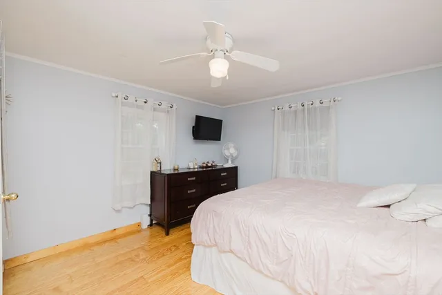 a bedroom with a bed and a dresser