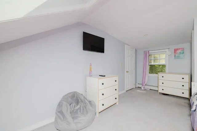 a room with furniture and flat screen tv