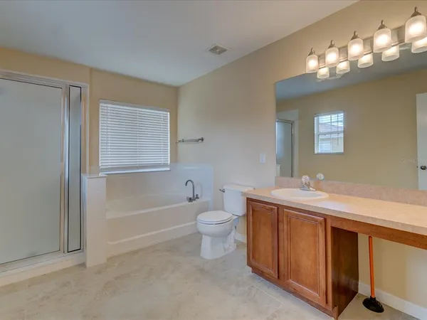 a bathroom with a sink a toilet and bathtub