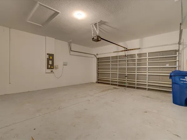 a view of an empty room with storage