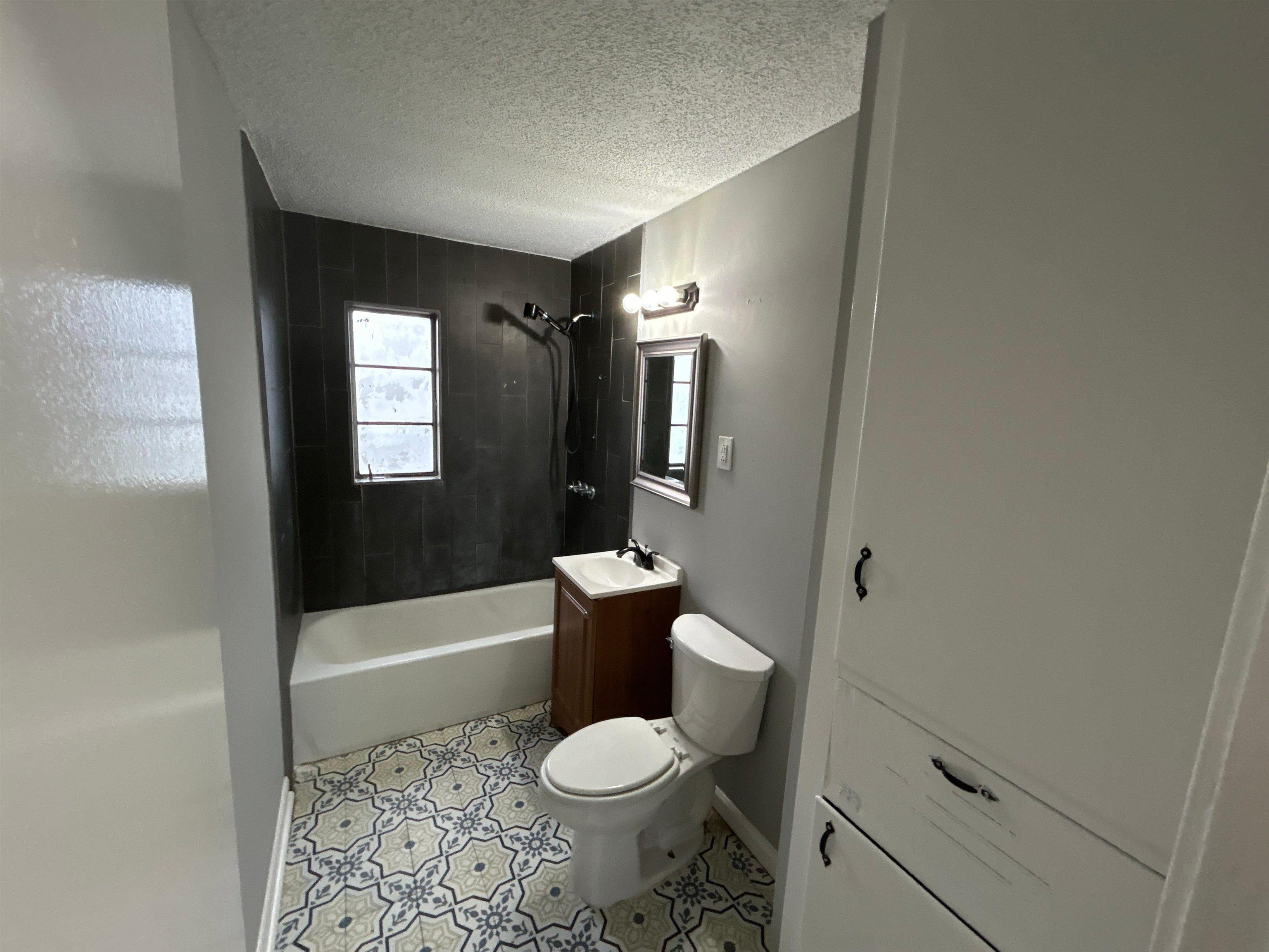 3509 Brantley Road Memphis, TN 38109 - Photo 2 of 9 a bathroom with a toilet sink and bathtub